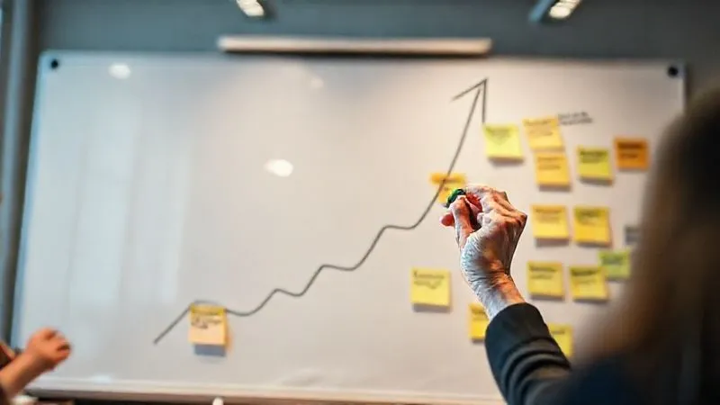 photorealistic, professional photography, 8K, cinematic lighting, sharp focus, depth of field, shot on a high-end DSLR, a hand drawing an upward-spiraling arrow on a whiteboard, surrounded by sticky notes with feedback and data points, symbolizing continuous improvement and adaptive CSR governance, in a collaborative workshop setting.