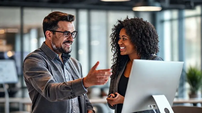A photorealistic image of a supportive sales manager guiding a new sales representative through a complex CRM interface, with a clear, encouraging expression. Professional photography, 8K, cinematic lighting, sharp focus on their interaction, depth of field blurring the modern office background. Shot on a high-end DSLR. A photorealistic image of a supportive sales manager guiding a new sales representative through a complex CRM interface, with a clear, encouraging expression. Professional photography, 8K, cinematic lighting, sharp focus on their interaction, depth of field blurring the modern office background. Shot on a high-end DSLR.